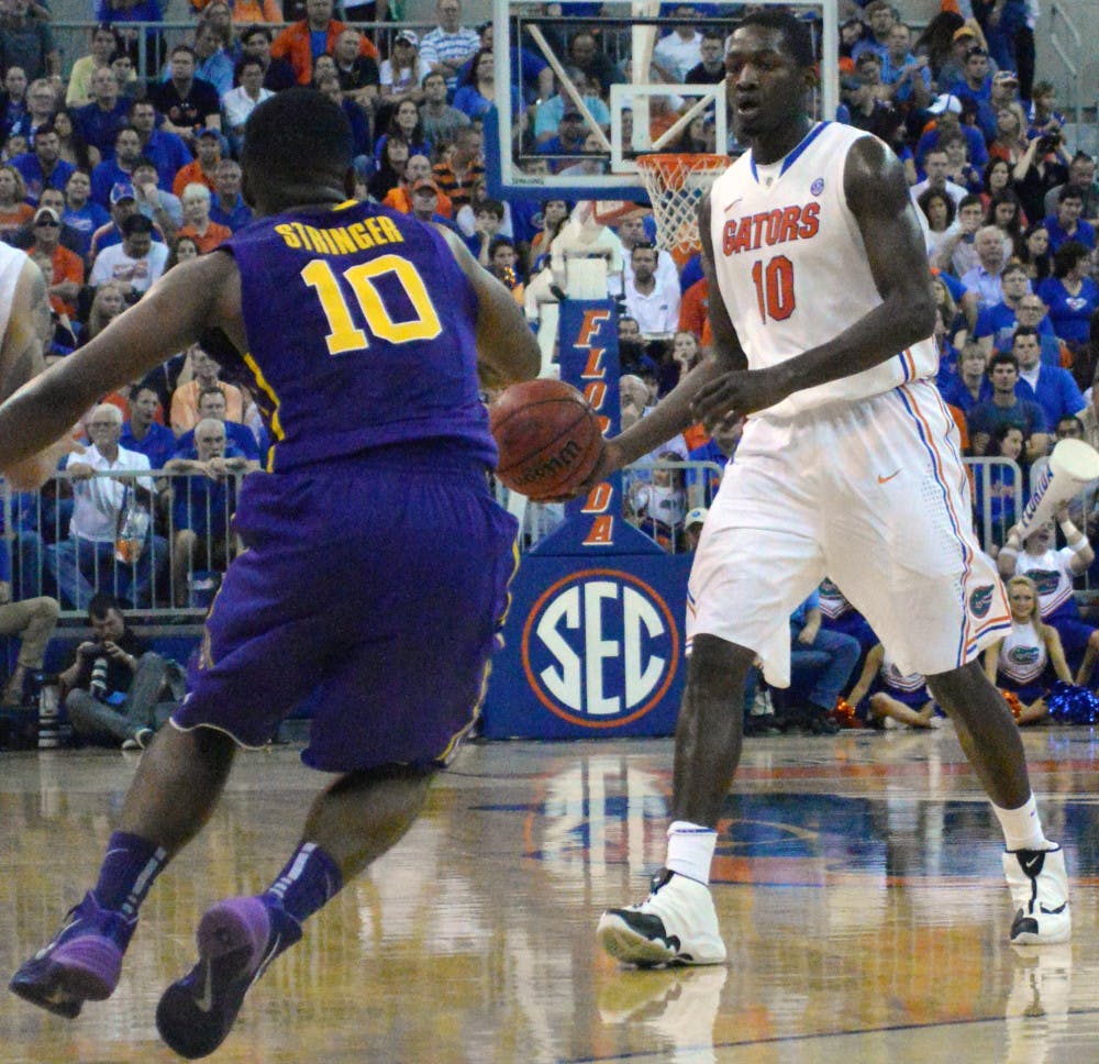 <p>Dorian Finney-Smith scans the court during Florida's 79-61 win against LSU on Saturday in the O'Connell Center. Finney-Smith scored a team-high 16 points in the Gators' win over the Tigers.</p>