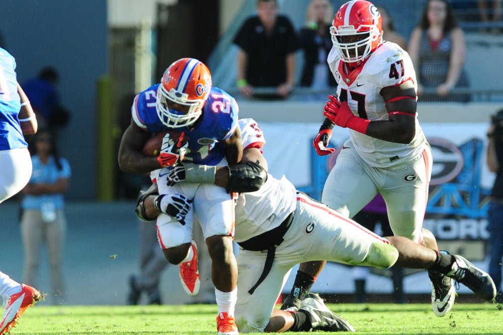 Kelvin Taylor rushes during Florida's 23-20 loss to Georgia on Nov. 2 at Everbank Field in Jacksonville.