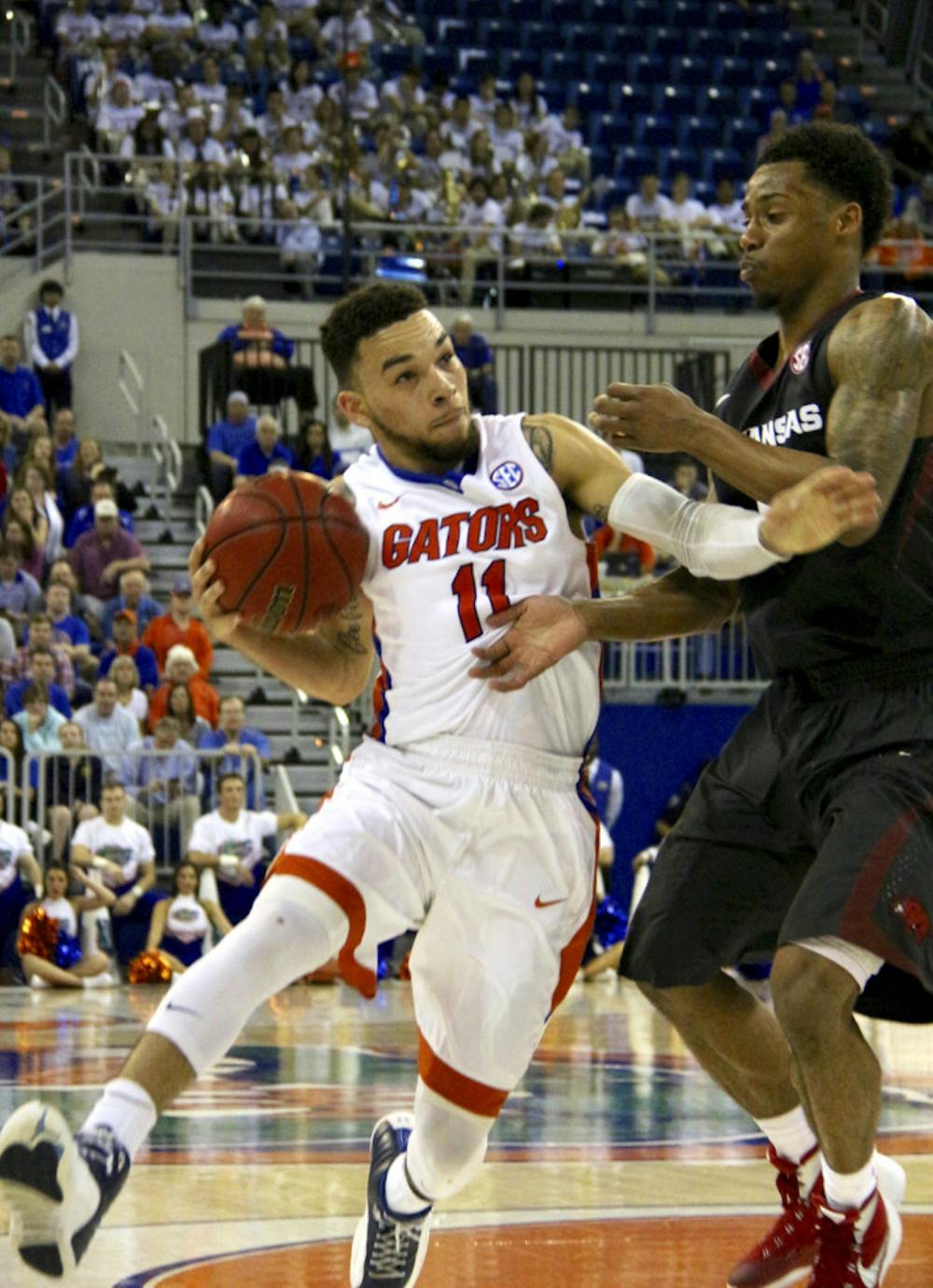 <p>UF guard Chris Chiozza drives into the paint during Florida's 87-83 win over Arkansas on Feb. 3, 2016, in the O'Connell Center. </p>
