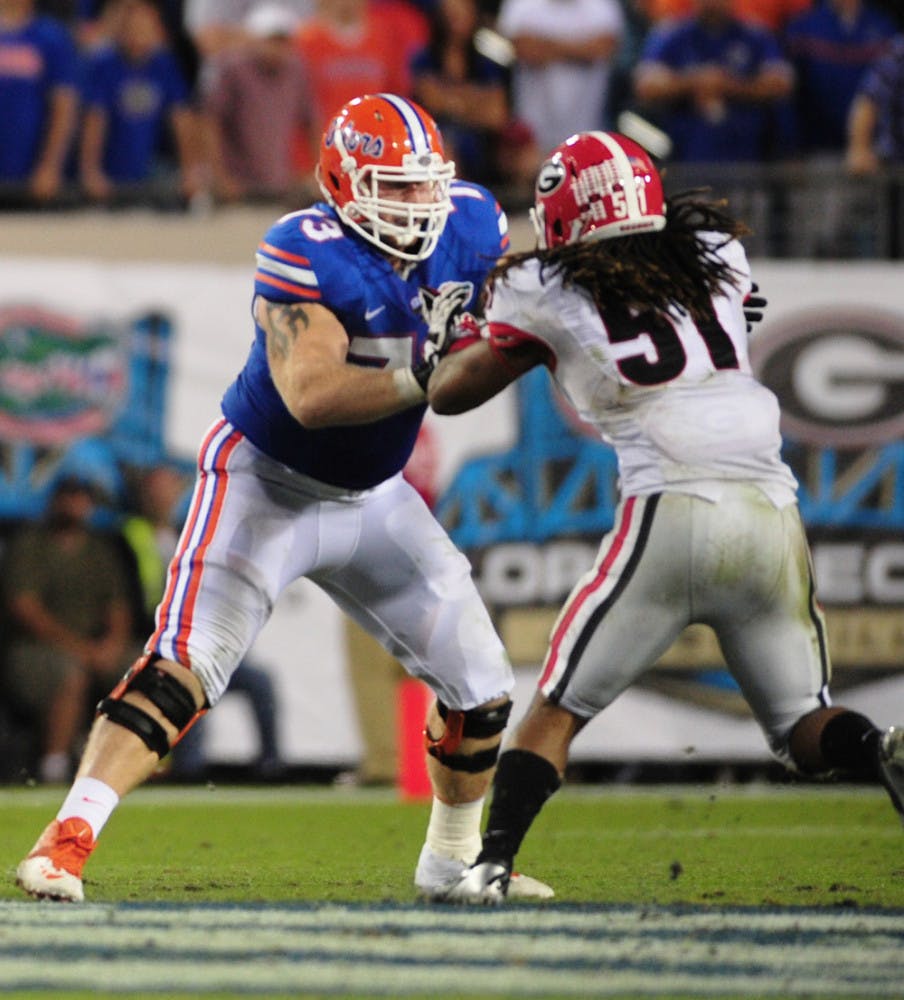 Tyler Moore (73) blocks Georgia junior inside linebacker Ramik Wilson (51) during Florida’s 23-20 loss to the Bulldogs on Saturday at EverBank Field in Jacksonville.