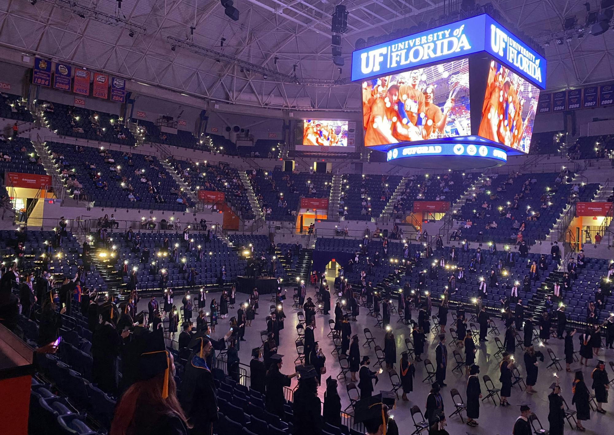 UF graduates stand and sing along to Tom Petty's "I Won't Back Down" during the 2021 graduation ceremony on Saturday, May 1, 2021. (Photo by Makiya Seminera)