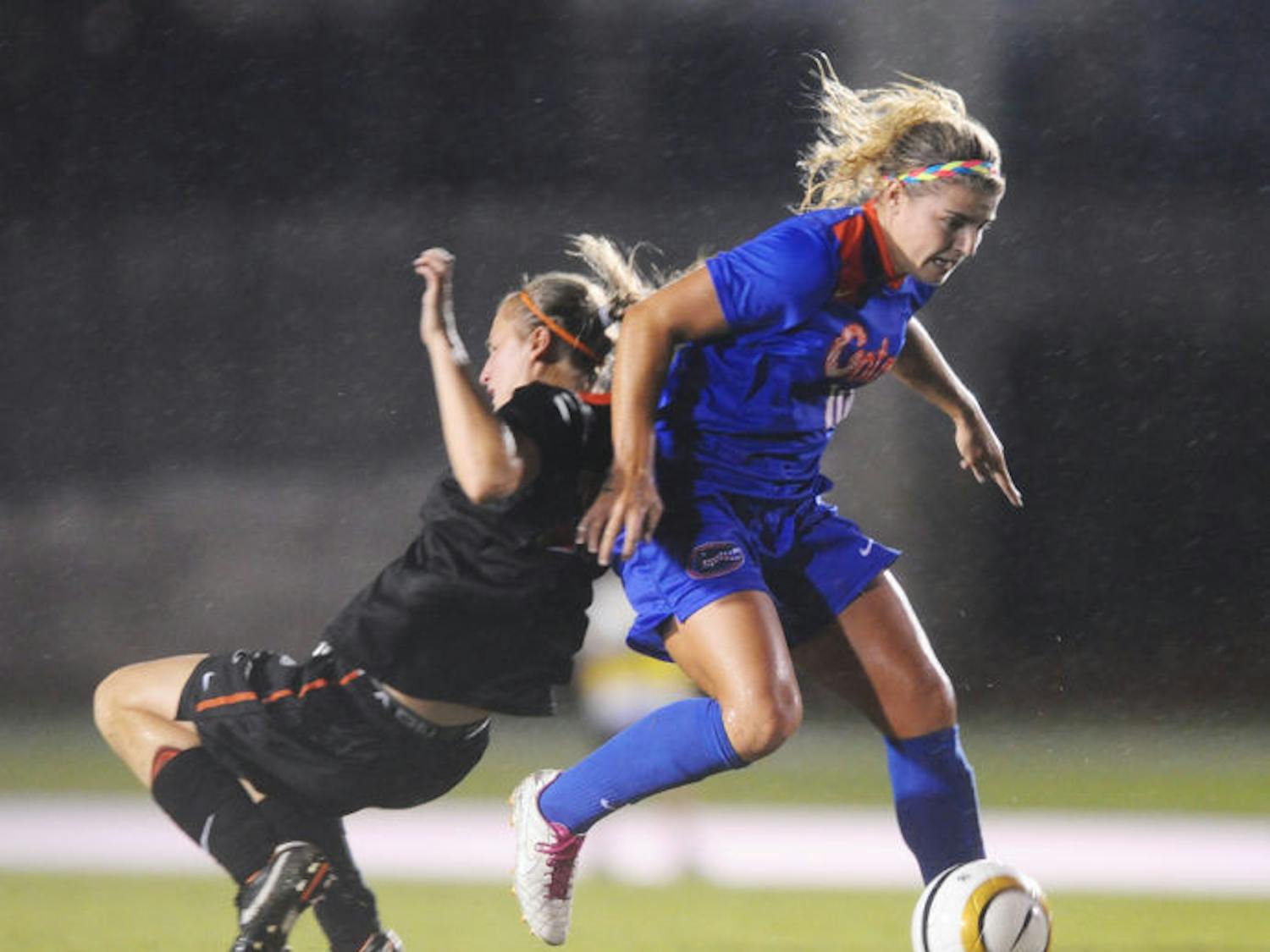 Savannah Jordan (right) dribbles past Oregon State’s Kathryn Baker on Aug. 25 at James G. Pressly Stadium. Jordan scored three times during the game.