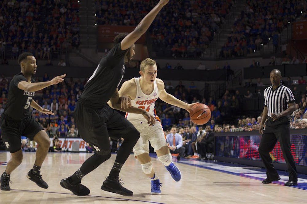 <p>UF guard Canyon Barry dribbles during Florida's 71-62 win over Texas A&amp;M on Feb. 11, 2017, in the O'Connell Center.</p>