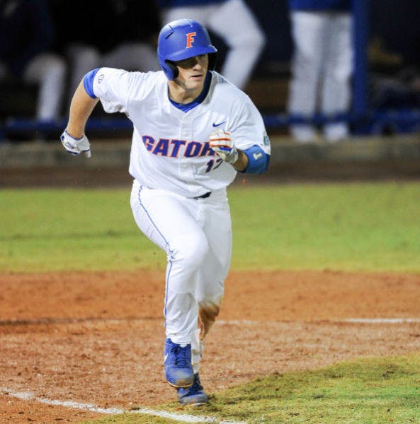 Taylor Gushue runs toward first base during Florida’s 4-0 win against Maryland on Feb. 14 at McKethan Stadium.