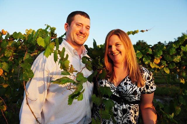 Bradley and Jennifer Ferguson pose in their vineyard, Bluefield Estate Winery, on Wednesday.