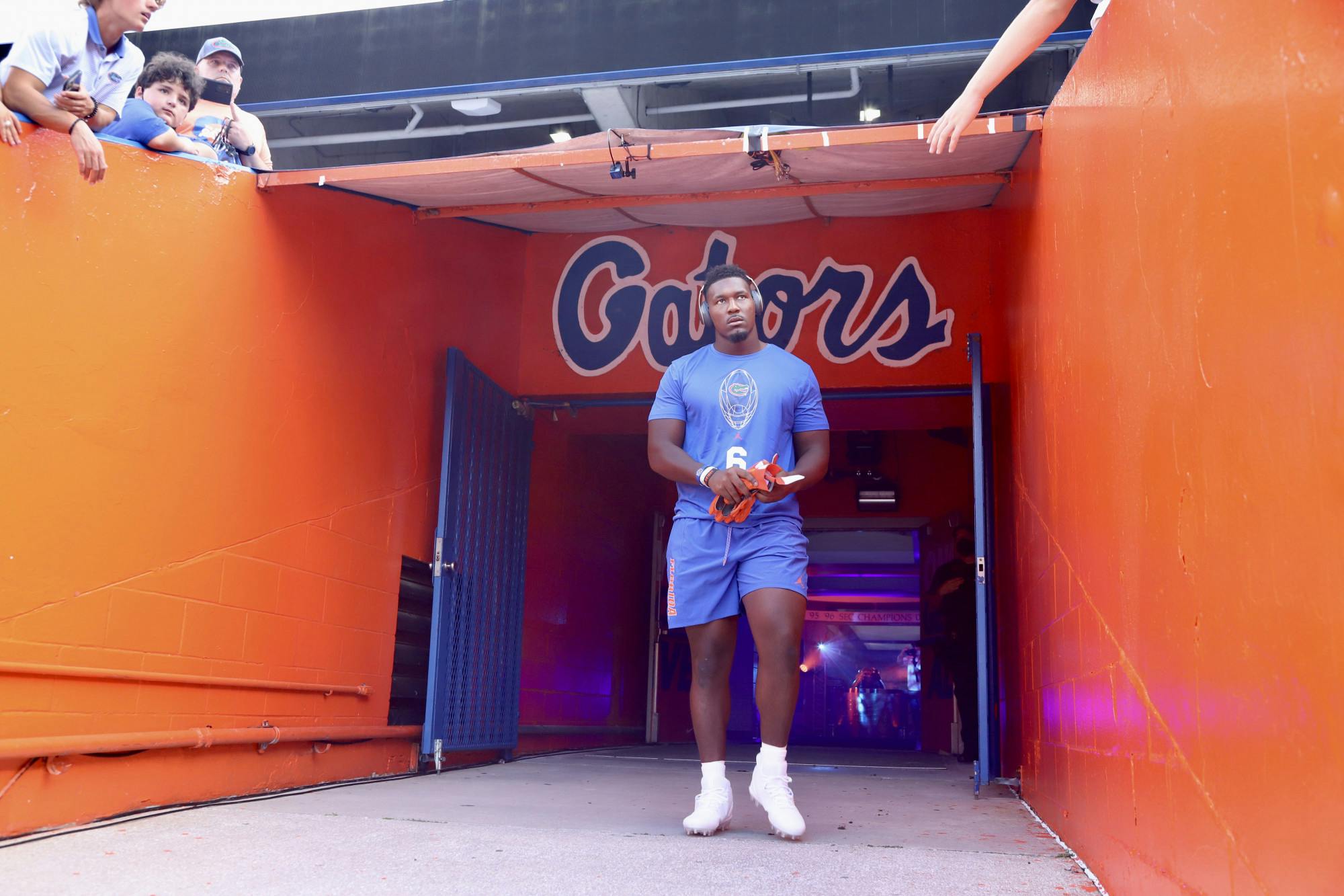 Florida defensive end Zachary Carter walks on to the field at Ben Hill Griffin Stadium for warmups ahead of the Gators' season opener against Florida Atlantic on Sept. 4.