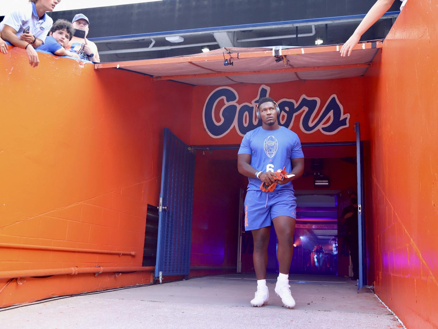 Florida defensive end Zachary Carter walks on to the field at Ben Hill Griffin Stadium for warmups ahead of the Gators' season opener against Florida Atlantic on Sept. 4.