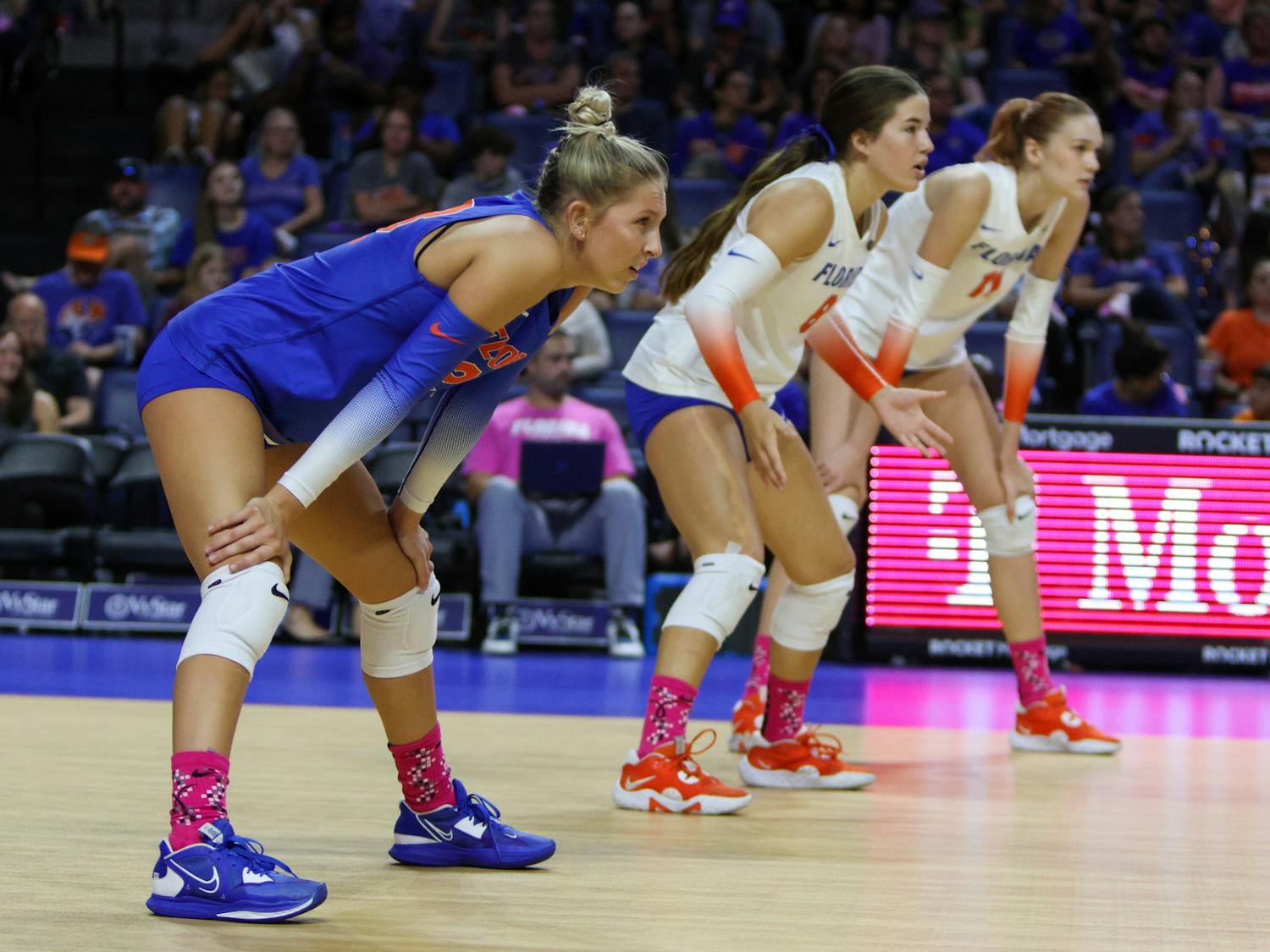Libero Elli McKissock (left), defensive specialist Trinity Adams (center) and outside hitter Marina Markova prepare for a point during Florida's match with the LSU Tigers Saturday, Oct. 8, 2022. 