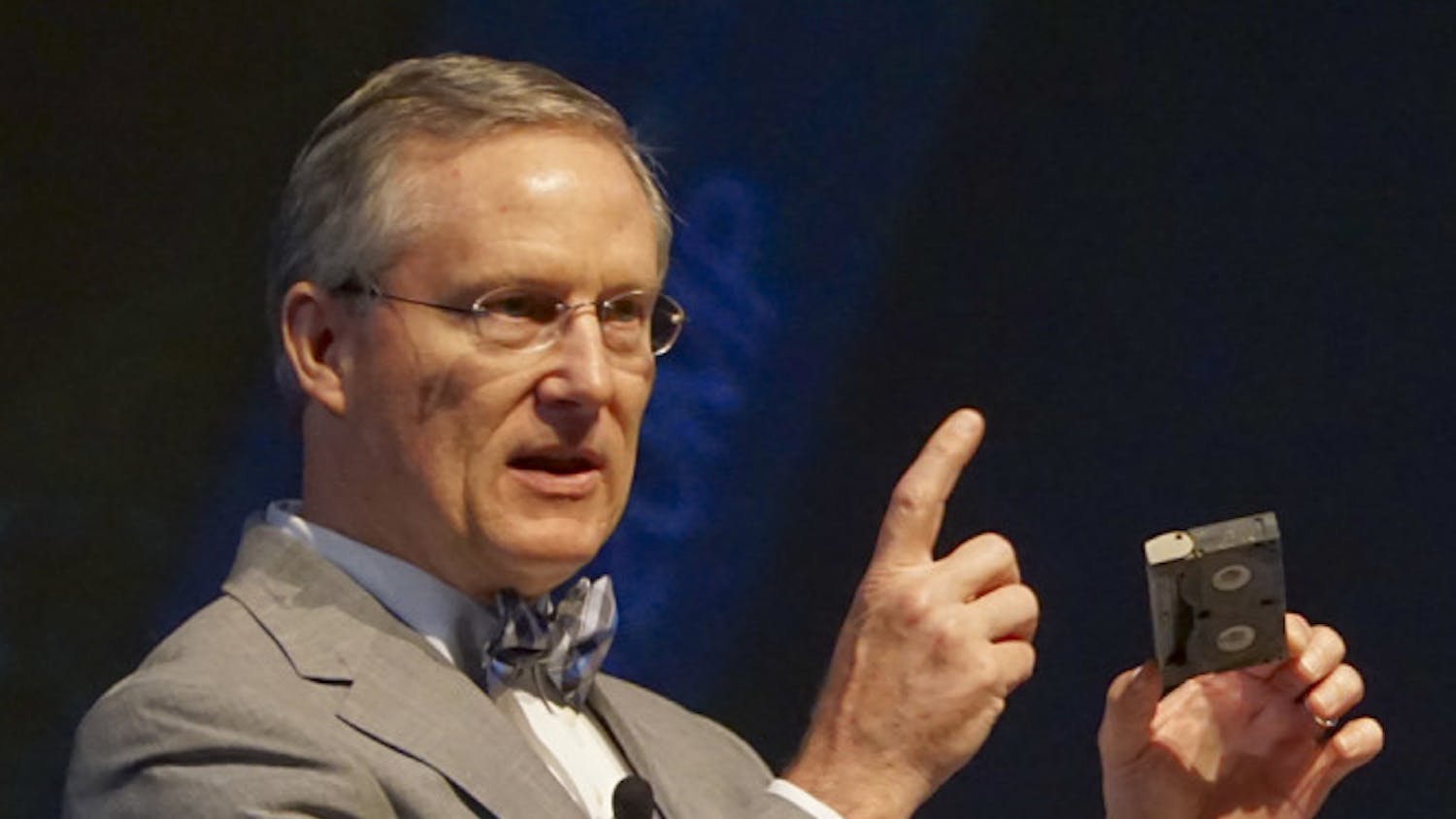 Chuck Clemons, Santa Fe’s Vice President for Advancement, shows off a water-damaged compact VHS tape from a 25-year-old time capsule during Santa Fe College's Convocation on Monday. Baseball cards, photos and other memorabilia were recovered from the container as well.