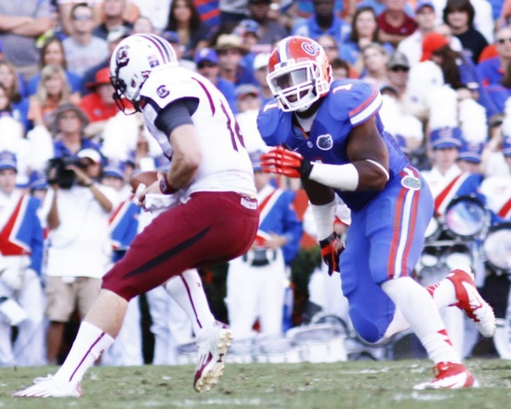 <p><span>Senior linebacker Jon Bostic (1) runs down South Carolina quarterback Connor Shaw during Florida’s 44-11 win on Saturday at Ben Hill Griffin Stadium. Bostic was selected by the Chicago Bears in the third round of the 2013 NFL Draft with the 50th overall pick.</span></p>