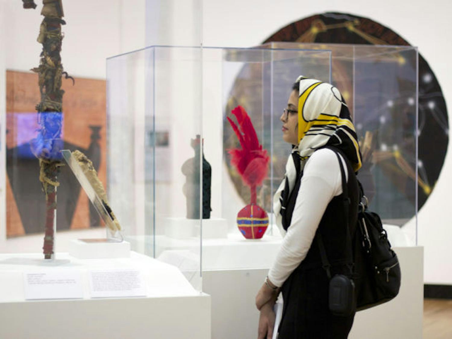 Faezeh Behzadnejad, 28, of New Jersey, browses “Kongo Across the Waters” Thursday at the Samuel P. Harn Museum of Art. The exhibit features archaeological discoveries and contemporary art.