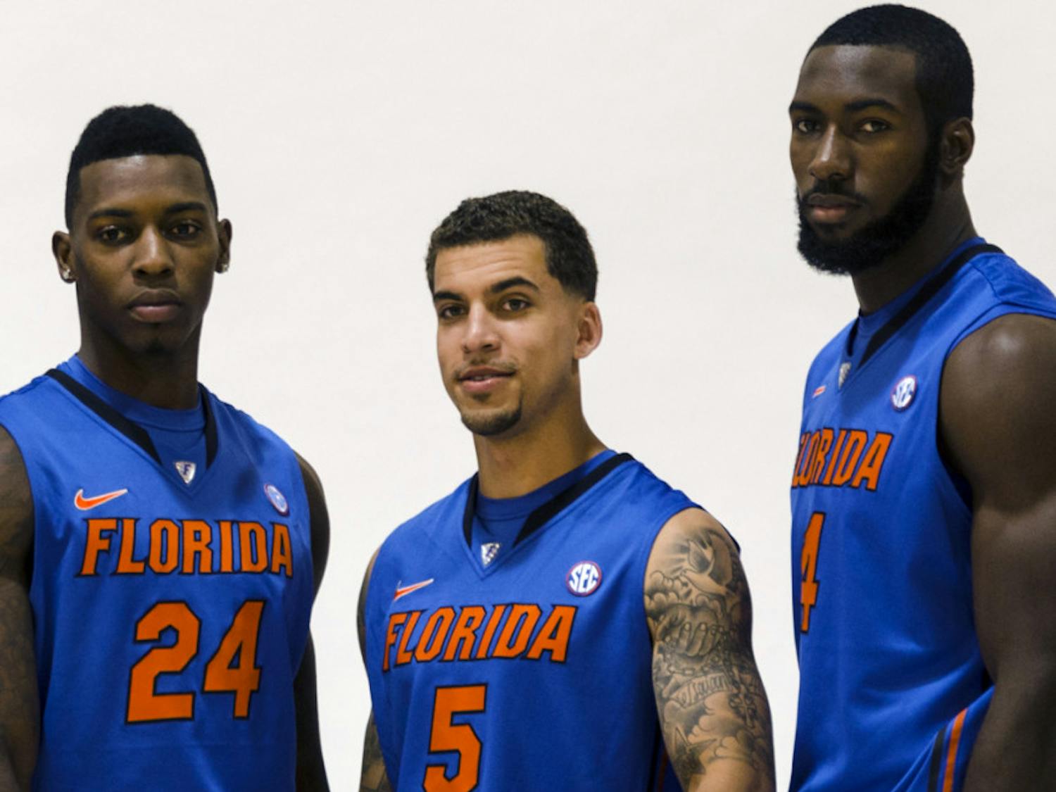 Scottie Wilbekin (center) poses for a photo with Casey Prather (left) and Patric Young (right) during Florida’s basketball media day on Oct. 9. Prather will miss Saturday's game, Wilbekin is questionable and Young will see limited minutes.