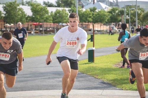 UF student Michael Larratt (center), an 18-year-old UF information systems sophomore, is flanked by Joe Freda (left), a 21-year-old UF political science junior, and Beau Butler (right), a 20-year-old UF nuclear engineering sophomore, as they zoom past the finish line. Larratt said he wanted to help out the cause.
&nbsp;