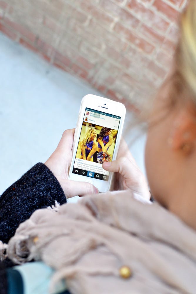UF pre-occupational therapy freshman Ellen Overby, 19, scrolls through her Instagram feed Wednesday morning.