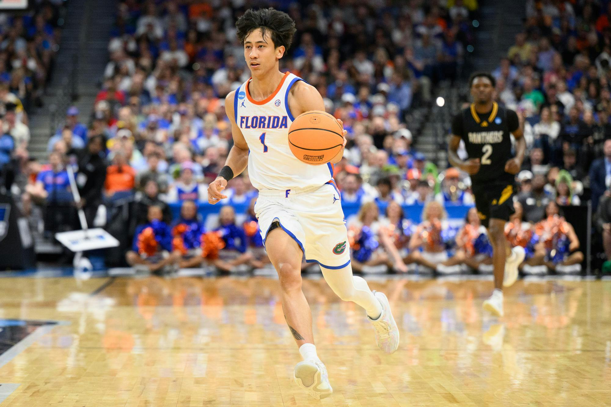 Florida guard Xaivian Lee (1) drives during the first half of an NCAA Tournament first round game against Prairie View A&M, Friday, March 20, 2026, in Tampa, Fla.