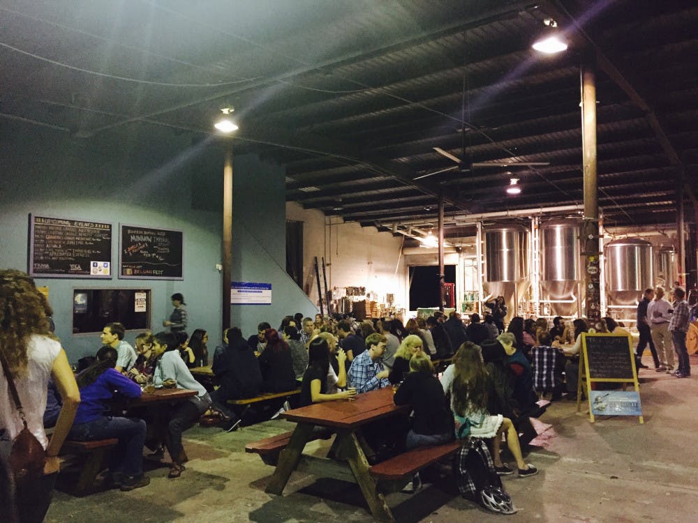 About 100 people gathered at First Magnitude Brewing Company Thursday to drink beer and socialize with female scientists in honor of International Day of Women and Girls in Science.