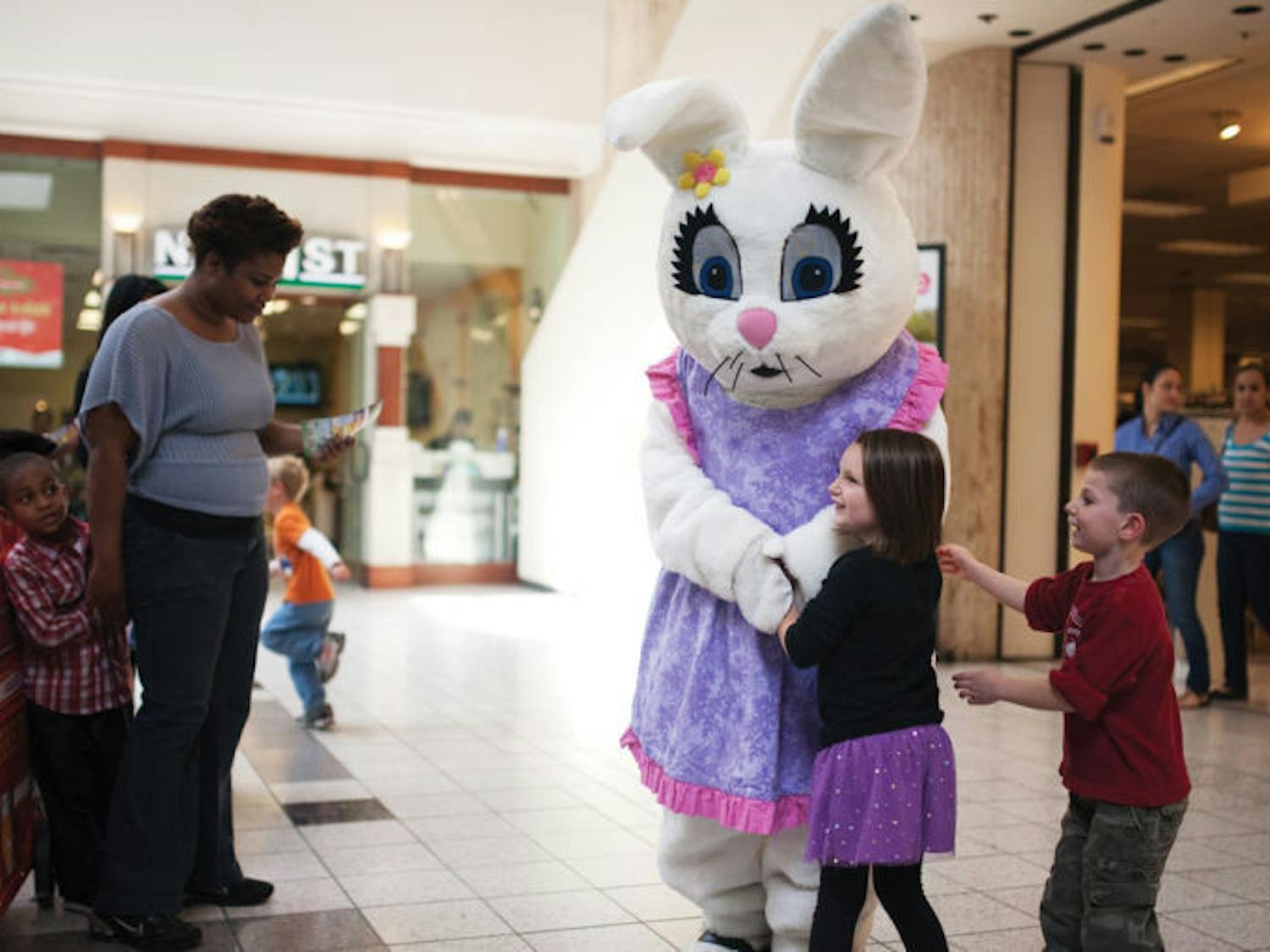Children clamor for the Easter Bunny at the Oaks Mall on Thursday. In celebration of the holiday, WorldWide Photography is providing the opportunity for children to take pictures with the Easter Bunny until Saturday.