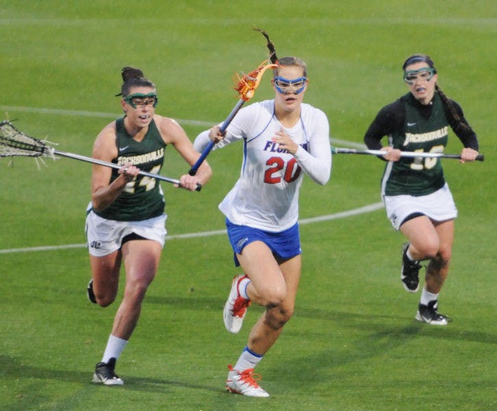 Devon Schneider drives toward the net during Florida’s 21-5 win against Jacksonville on Wednesday at Donald R. Dizney Stadium. Schneider scored four points against the Dolphins after she was held scoreless against the Tar Heels in the Gators’ 20-8 season-opening loss on Feb. 8.