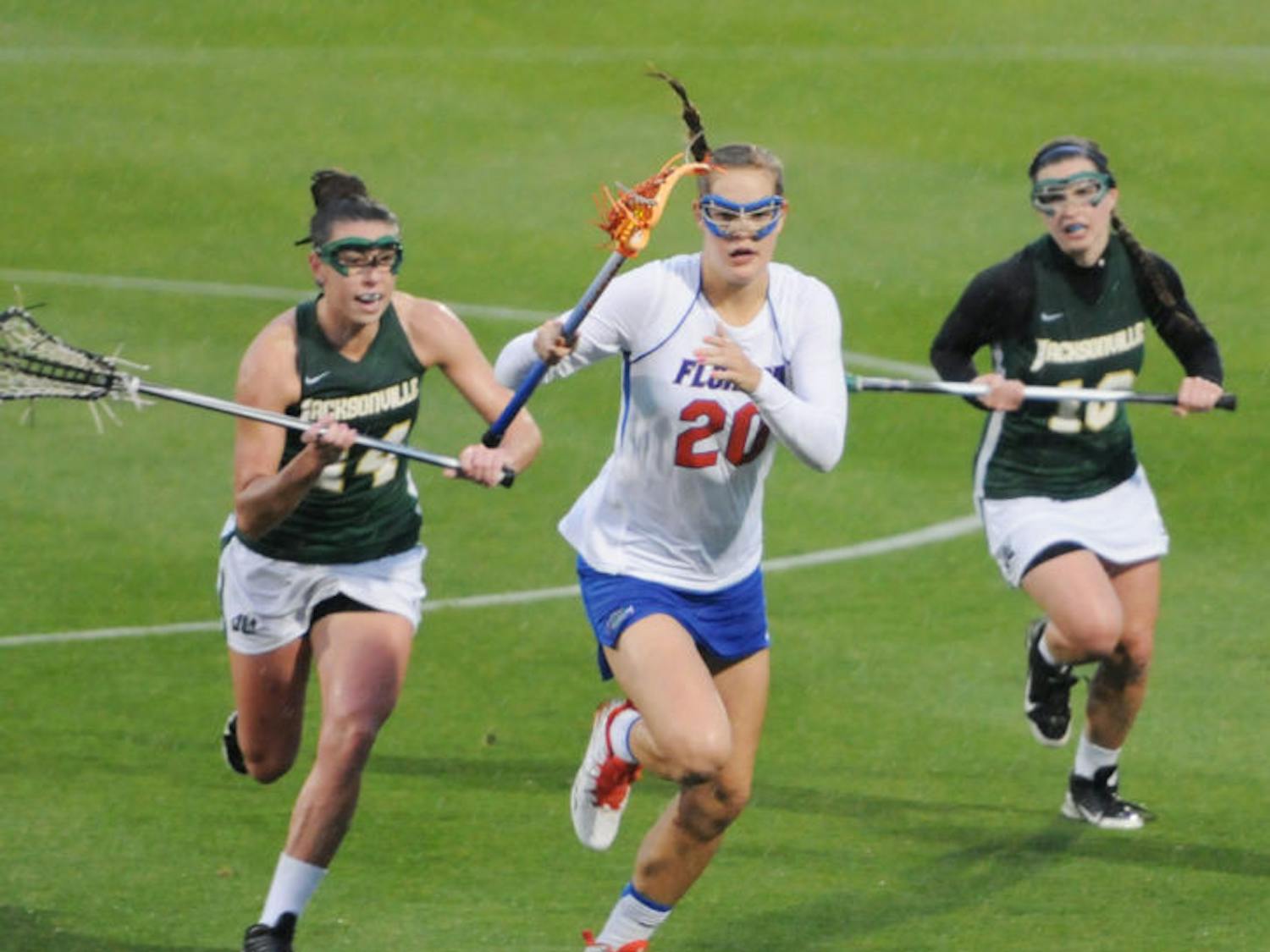 Devon Schneider drives toward the net during Florida’s 21-5 win against Jacksonville on Wednesday at Donald R. Dizney Stadium. Schneider scored four points against the Dolphins after she was held scoreless against the Tar Heels in the Gators’ 20-8 season-opening loss on Feb. 8.