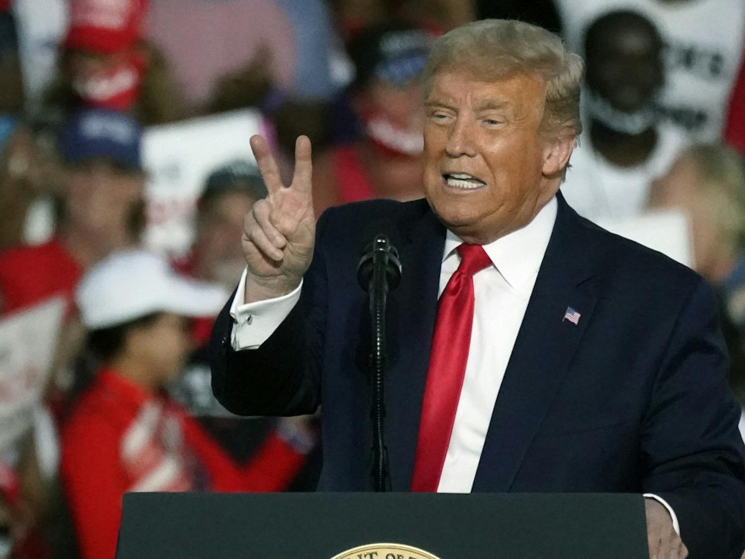 President Donald Trump speaks at a campaign rally at the Orlando Sanford International Airport Monday, Oct. 12, 2020, in Sanford, Fla.