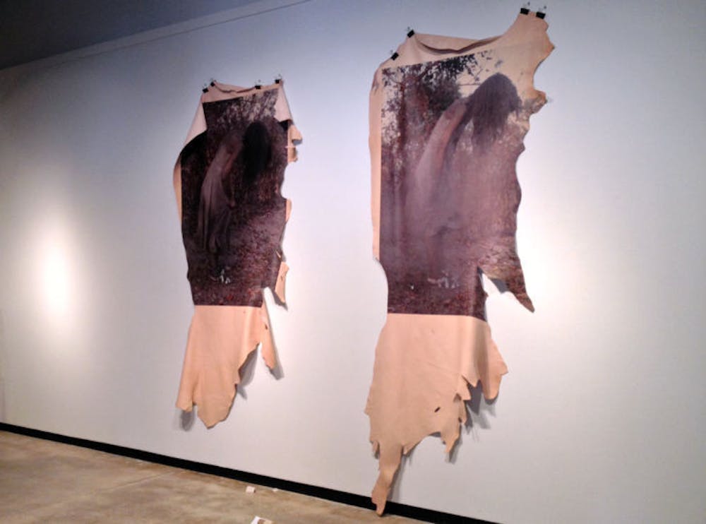<p>In the University Gallery, two photos taken by Naomi Fisher are printed on leather, an uncommon surface for printing that she had to special order from New York.</p>