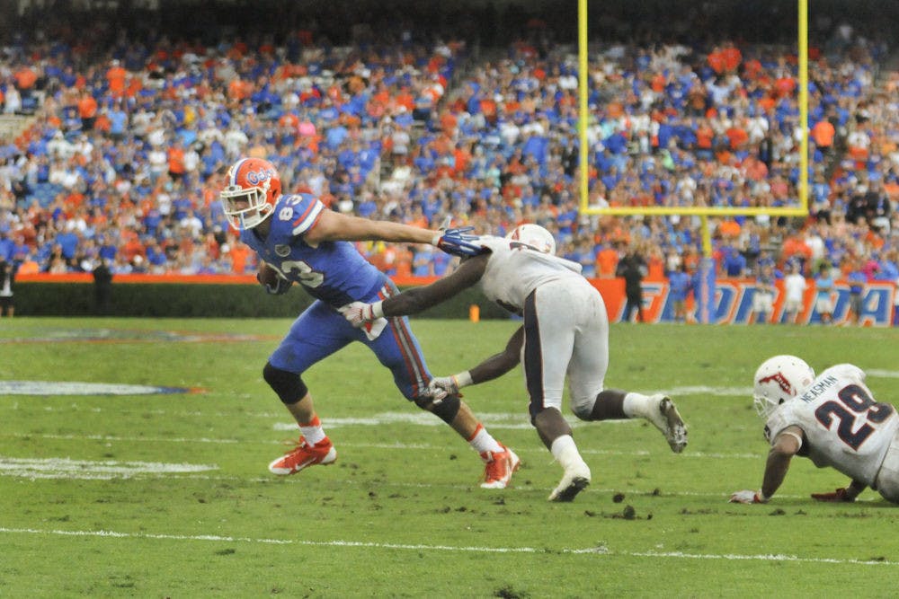 UF tight end Jake McGee breaks past a defender on his way to the game-winning touchdown in Florida's 20-14 overtime win against Florida Atlantic on Nov. 21, 2015, at Ben Hill Griffin Stadium.