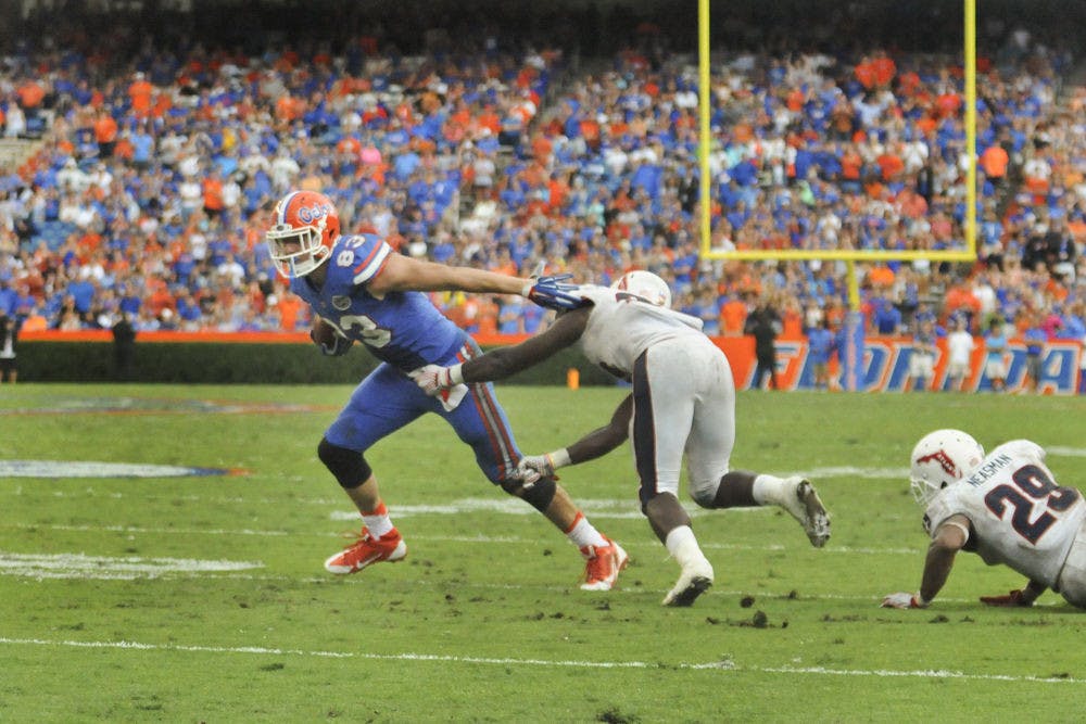 <p>UF tight end Jake McGee breaks past a defender on his way to the game-winning touchdown in Florida's 20-14 overtime win against Florida Atlantic on Nov. 21, 2015, at Ben Hill Griffin Stadium.</p>