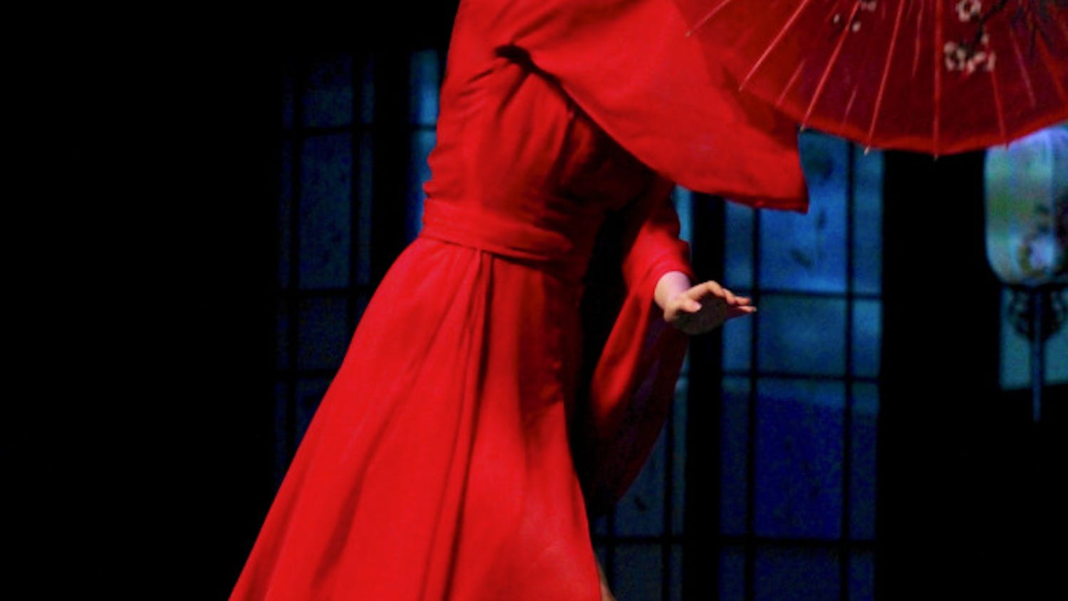 A dancer within the UF Chinese Student Association Dance Club performs in a piece titled "Zhi Zi Yugui + Cry Cry" while adorning traditional Chinese garments in honor of the new year inside the Phillips Center for Performing Arts on Sunday night.