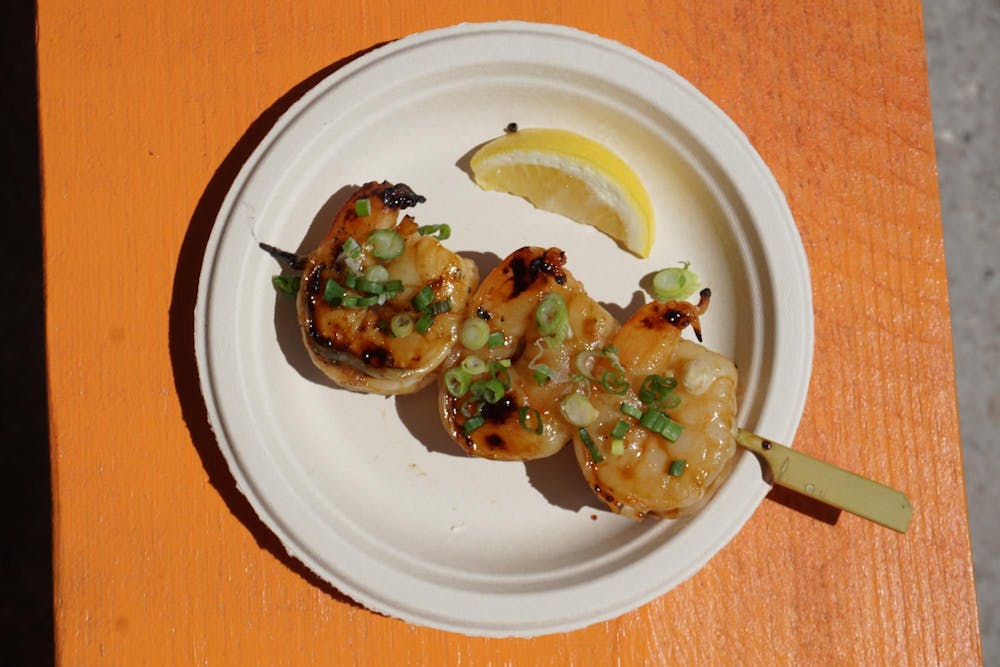 Yakitori, a Japanese dish of skewered, bite-sized pieces, is often served out of small stands in bus or subway stations in Japan.