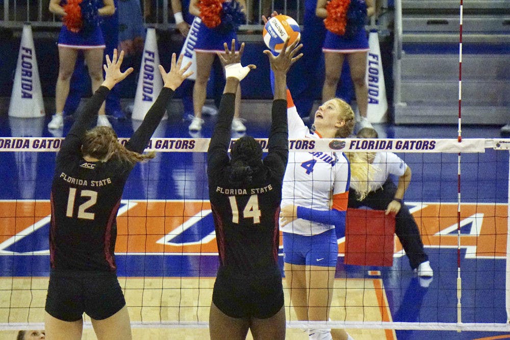 <p>UF outside hitter Carli Snyder swings for a kill attempt during Florida's 3-1 win on Sept. 20, 2015, in the O'Connell Center.</p>