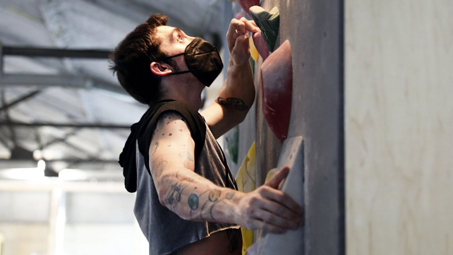 Jeremy Mall, 25, a culinary teacher at East Side high school, practices rock climbing in a homemade crop top at The Knot Climbing Gym on Tuesday, June 1, 2021. Mall is an avid "Crop Top Tuesday" participant, and he said climbing in crop tops is fun and freeing. 