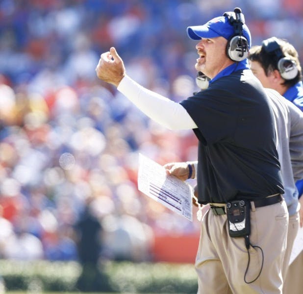 Defensive coordinator Dan Quinn shouts to his defensive linemen during Florida’s 14-7 victory against Missouri on Saturday at Ben Hill Griffin Stadium.&nbsp;
