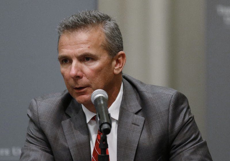 Ohio State coach Urban Meyer was suspended for the team’s first three games for mishandling repeated professional and behavioral problems of assistant coach Zach Smith.