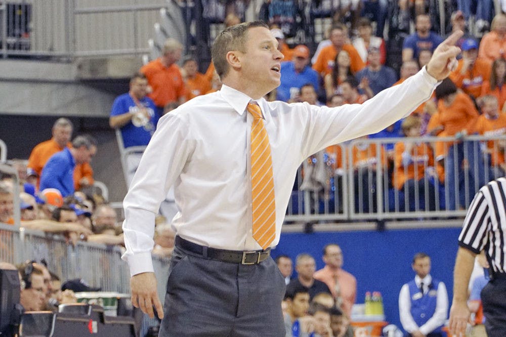 Florida coach Mike White calls out instructions to his team during Florida's 88-79 loss to Kentucky on March 1, 2016, in the O'Connell Center.