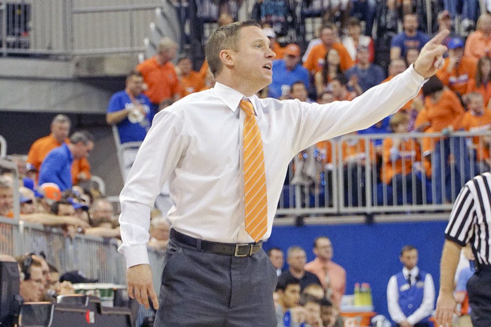 <p>Florida coach Mike White calls out instructions to his team during Florida's 88-79 loss to Kentucky on March 1, 2016, in the O'Connell Center.</p>
