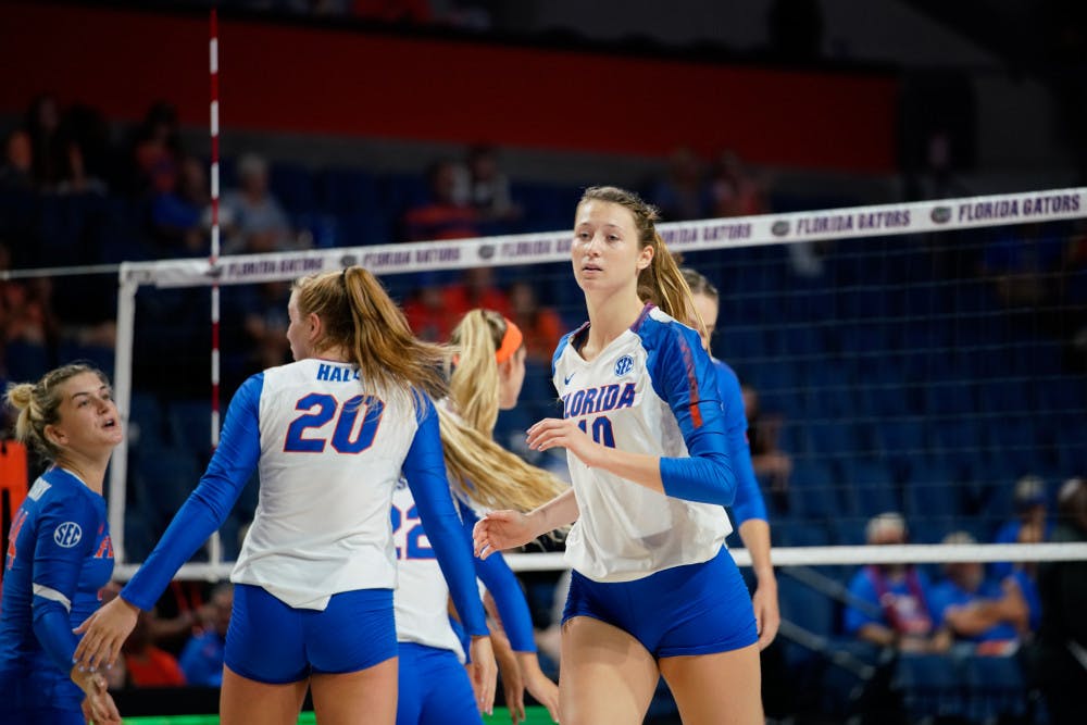 Redshirt sophomore Holly Carlton (right) was convinced by freshman Thayer Hall (middle) to transfer to the University of Florida.  