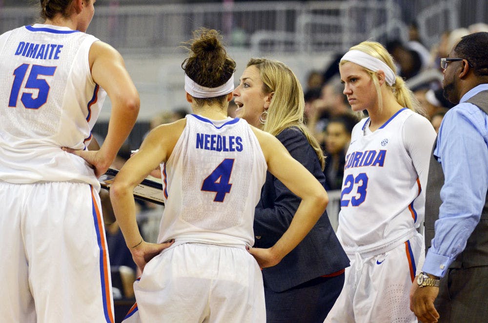 Amanda Butler addresses the team during a timeout during Florida's win against Stetson.