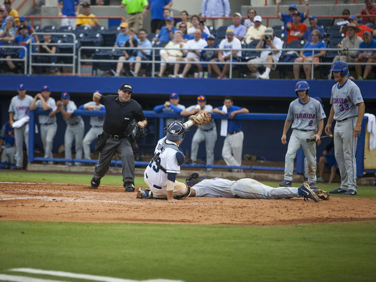 UF shortstop Richie Martin is tagged out at home plate by UNC catcher Korey Dunbar during Florida's 5-2 loss on Saturday at McKethan Stadium. The loss eliminated the Gators from the NCAA Tournament.