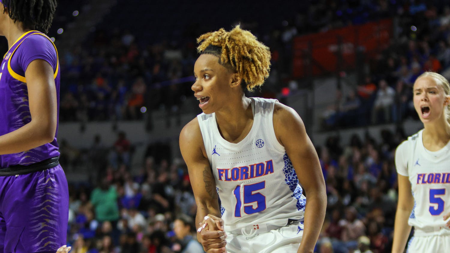 Florida guard Nina Rickards helps fellow UF guard KK Deans stand up during the Gators’ 90-79 loss to the Louisiana State Tigers Sunday, Feb. 19, 2023.