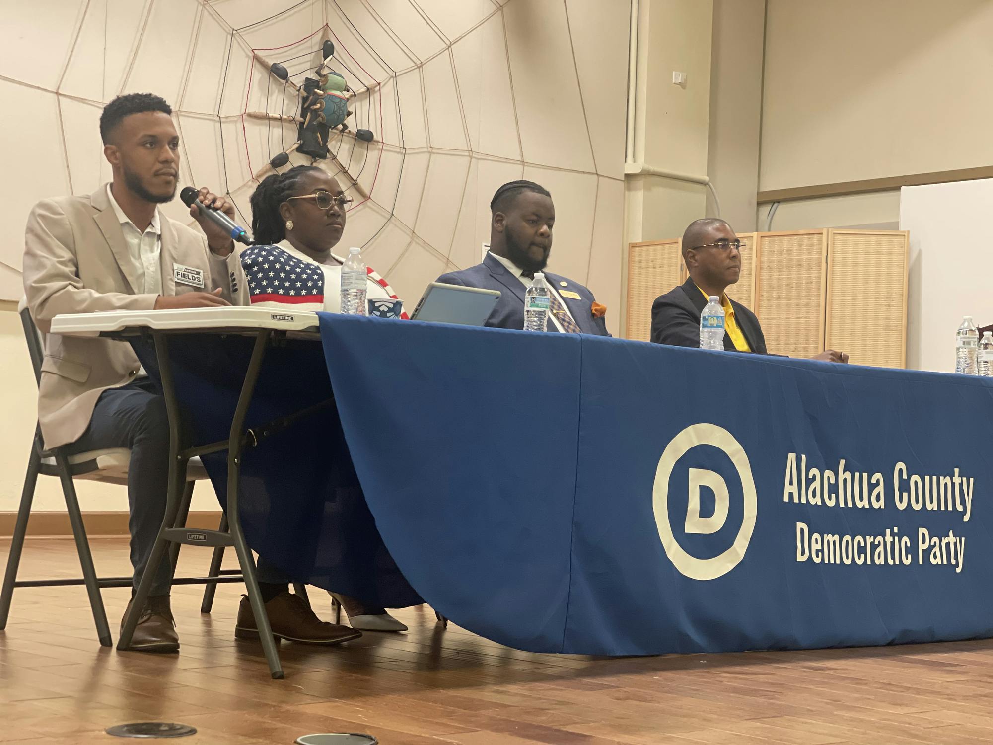 Antoine Fields, Jacquelyn Randall, Malik J. Moore and Xavier J. Monroe speak during a Democratic candidate forum, Thursday, July 2, 2026.