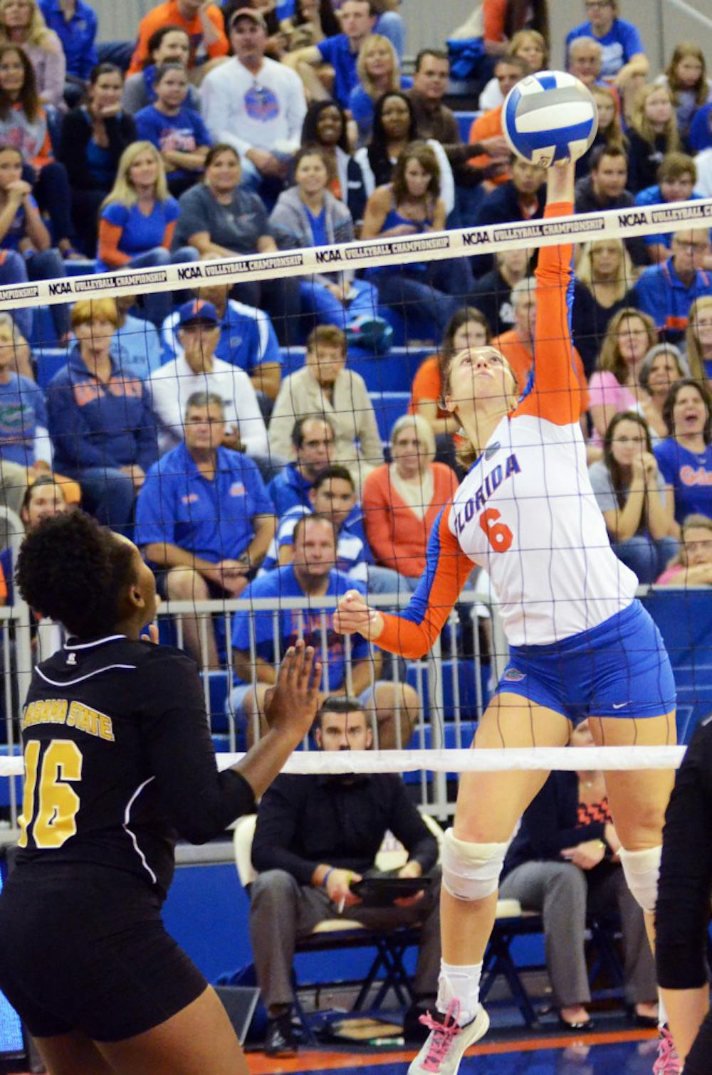 <p>Mackenzie Dagostino swings for a kill attempt during Florida's 3-0 win against Alabama State in the first round of the NCAA Tournament on Friday in the O'Connell Center.</p>