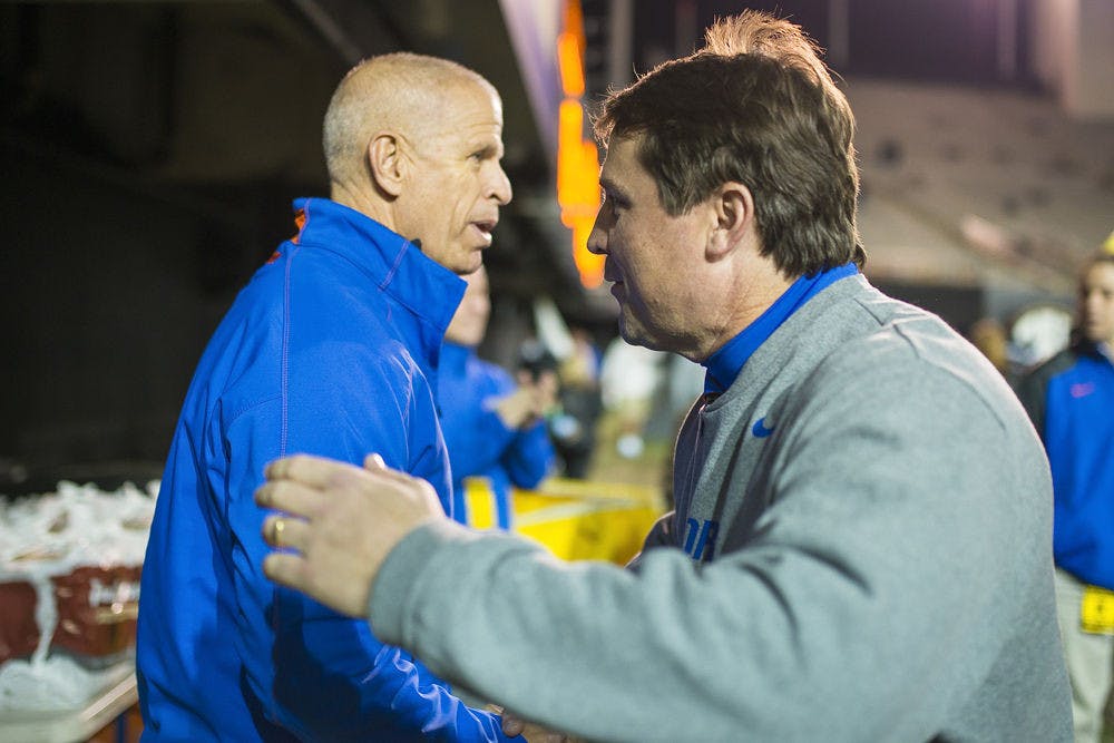<p>UF athletics director Jeremy Foley (left) and football coach Will Muschamp embrace following Florida's 34-10 win against Vanderbilt on Nov. 8 in Nashville, Tennessee.</p>