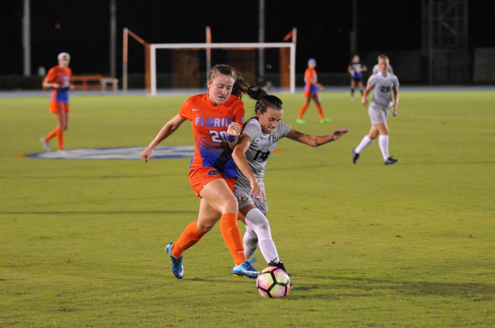Julia Lester (20) battles for possession during Florida's win over UCF at James G. Pressly Stadium on Sept. 18, 2016.