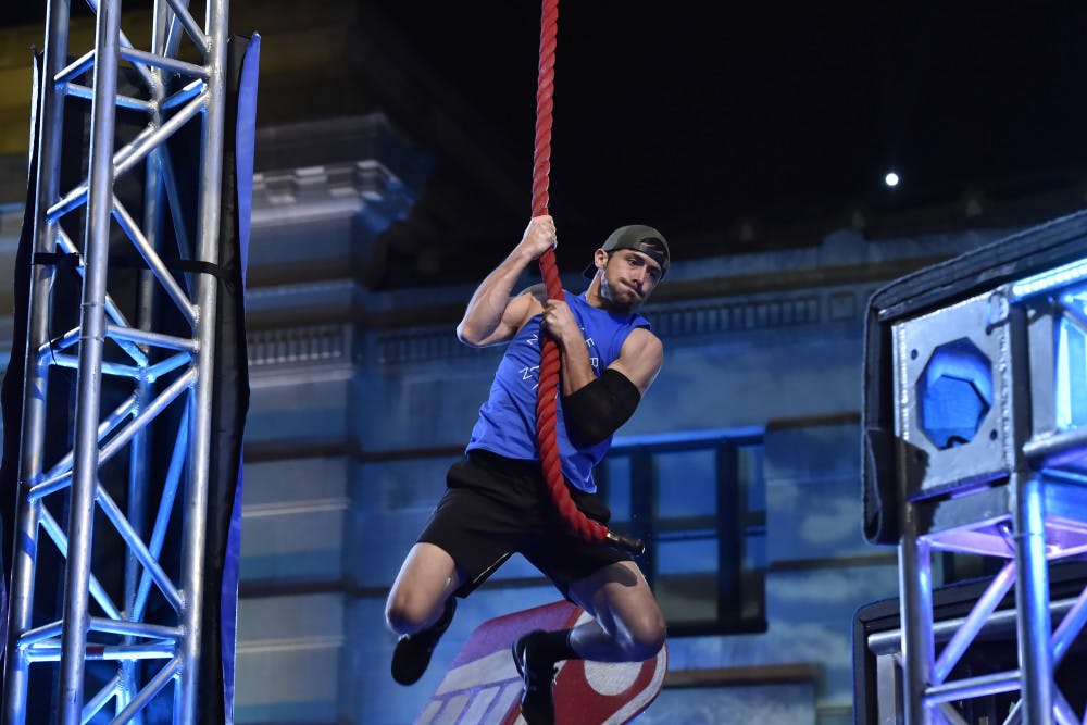 UF alumnus Drew Hendry swings through the "Floating Steps" obstacle in the Kansas City finals round of American Ninja Warrior season nine.