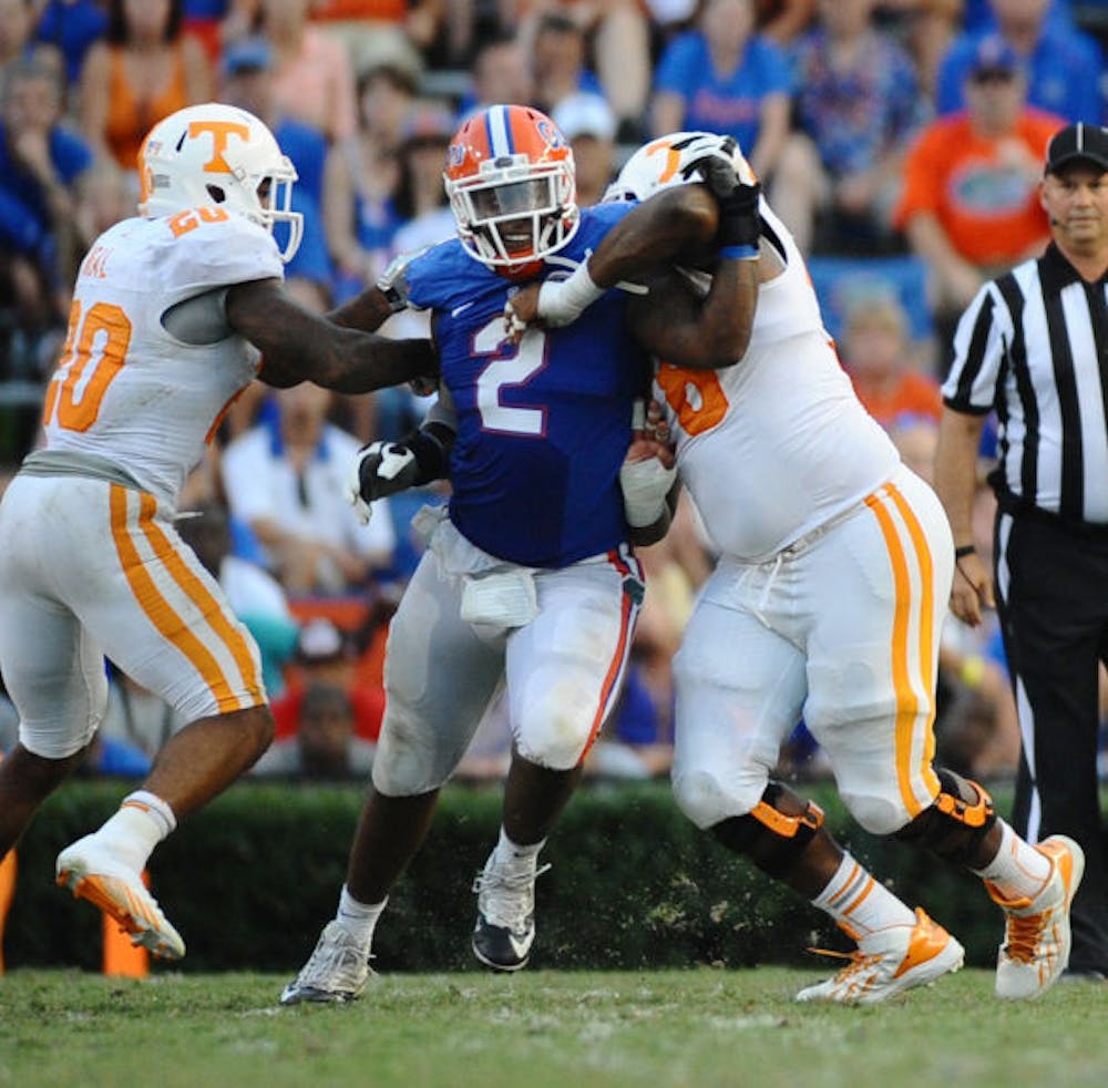 <p>Dominique Easley (2) pushes through two opposing players during Florida’s 31-17 win against Tennessee on Sept. 21 in Ben Hill Griffin Stadium.&nbsp;</p>