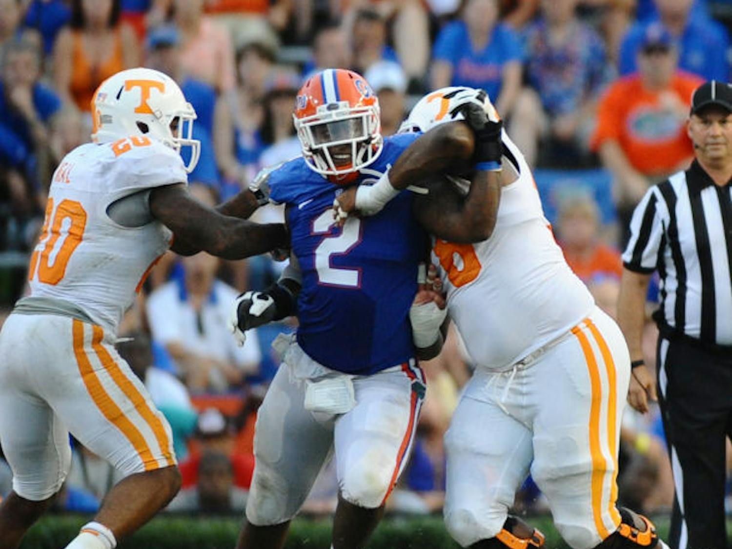 Dominique Easley (2) pushes through two opposing players during Florida’s 31-17 win against Tennessee on Sept. 21 in Ben Hill Griffin Stadium. 