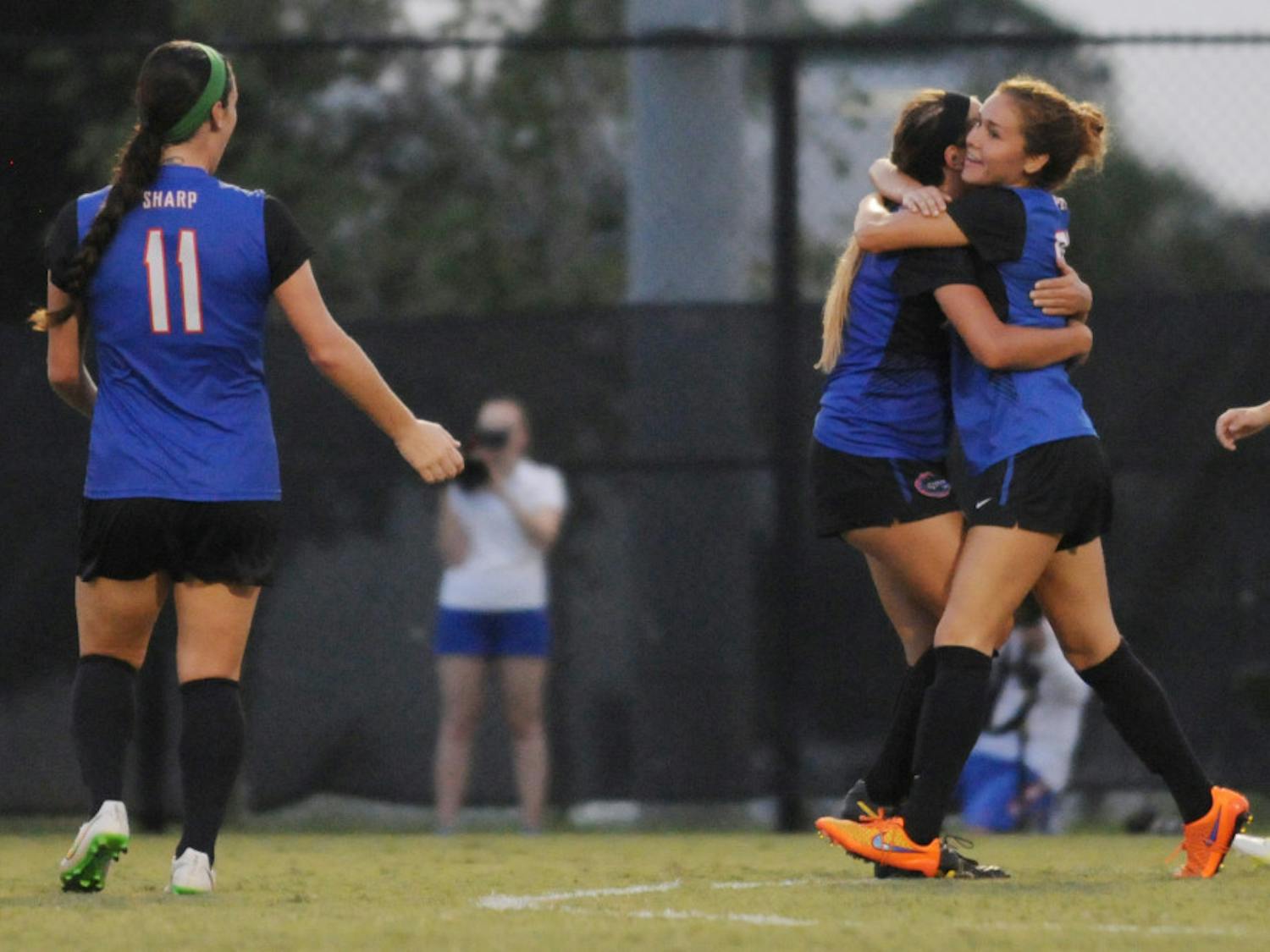 UF midfielder Mayra Pelayo hugs teammate Kristen Cardano after Pelayo scored the equalizer during Florida's 2-1 win against Troy in an exhibition match on Aug. 11, 2015, at the soccer practice field at Donald R. Dizney Stadium.