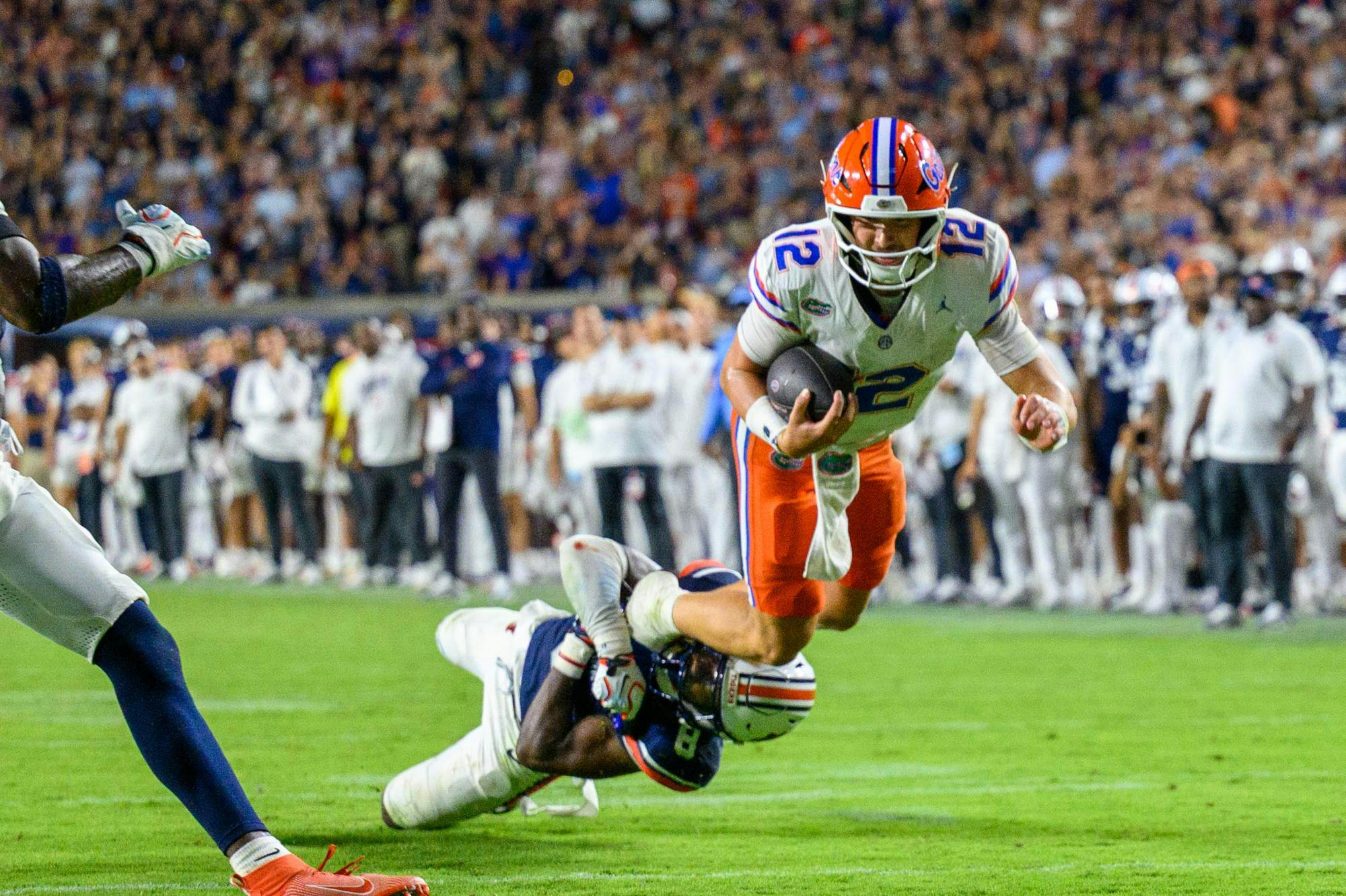 Florida quarterback Aaron Philo (12) struggles to the end zone during the first half of an NCAA college football game against Auburn, Saturday, Sept. 19, 2026, in Auburn, Ala.