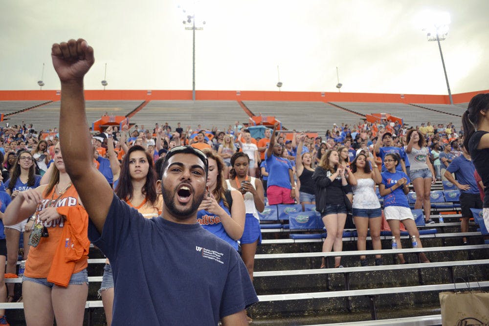 <p>Aaron Rampersad, a 21-year-old UF microbiology and nutritional sciences senior, shouts “Go Gators!” at the Rally in the Swamp event at Ben Hill Griffin Stadium Sunday. Rally goers were led through a series of chants and songs that will be used during UF sporting events.</p>