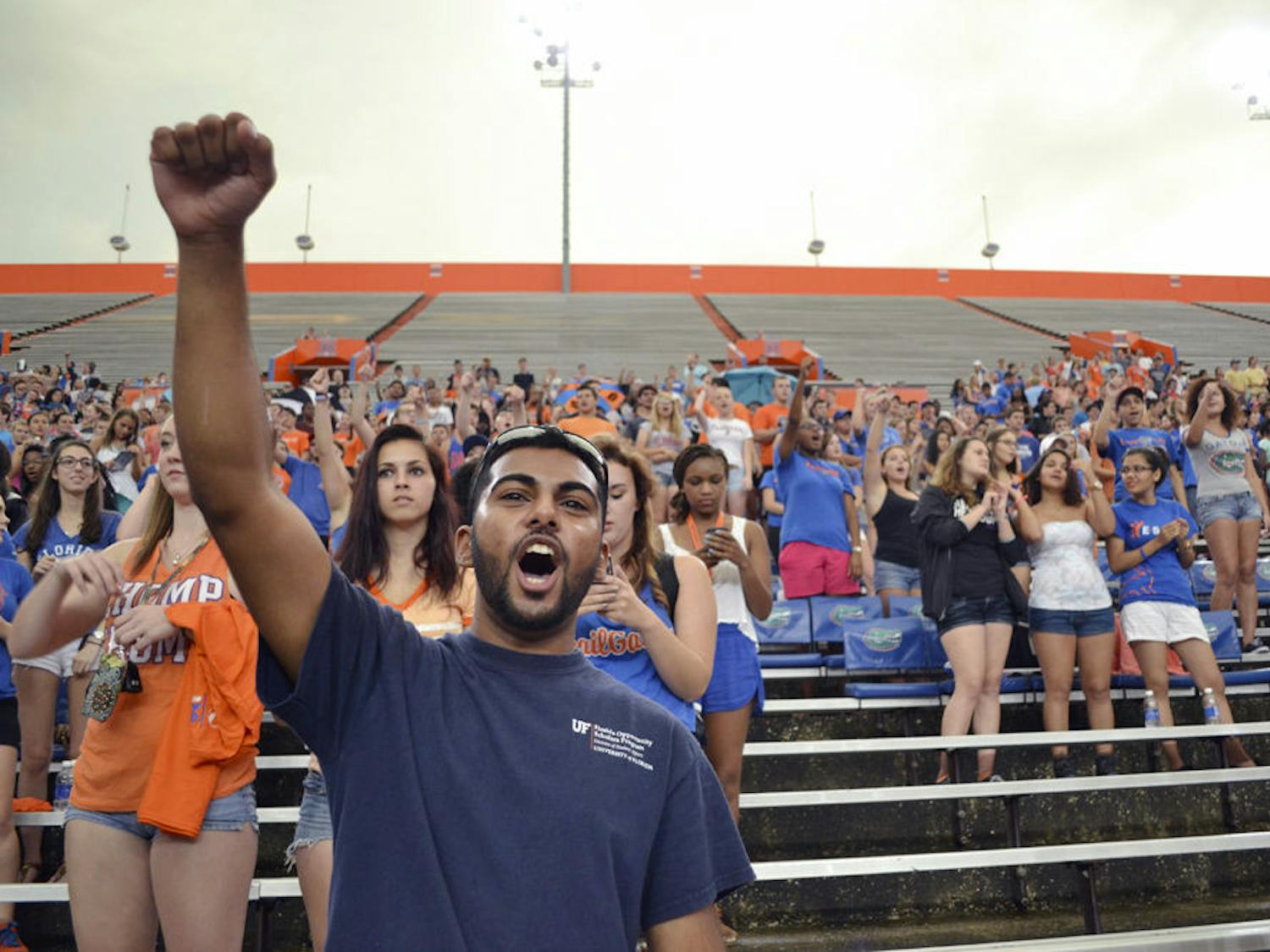 Aaron Rampersad, a 21-year-old UF microbiology and nutritional sciences senior, shouts “Go Gators!” at the Rally in the Swamp event at Ben Hill Griffin Stadium Sunday. Rally goers were led through a series of chants and songs that will be used during UF sporting events.